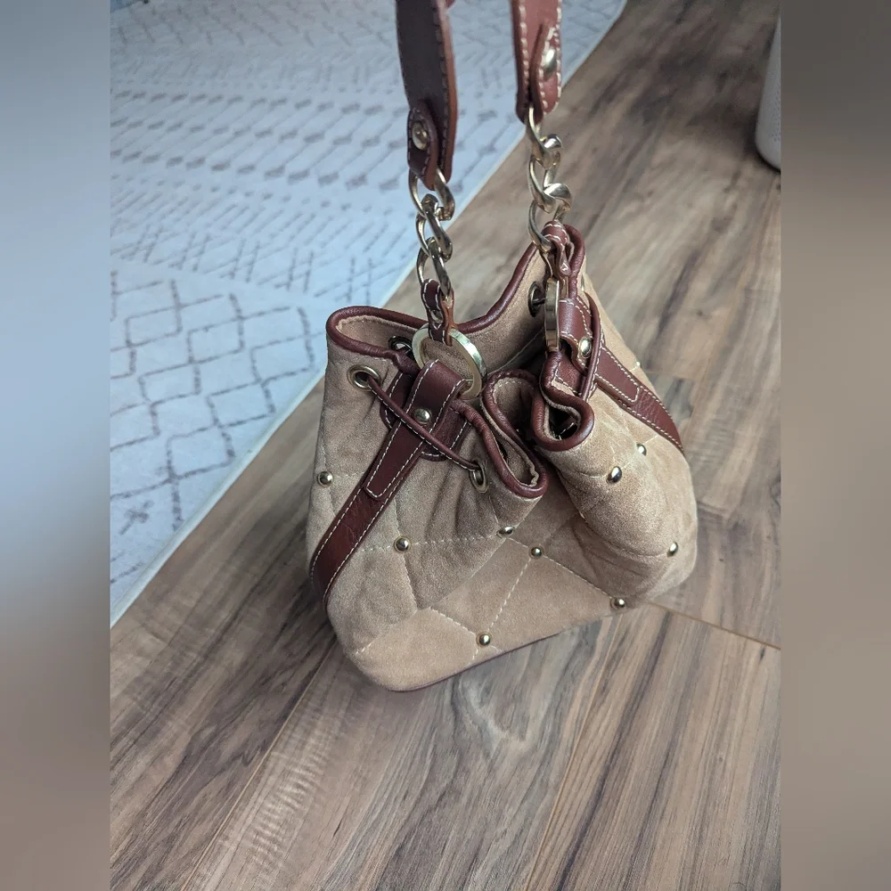 Claudia Firenze Leather Bucket Bag With Pull Top And Tassels.